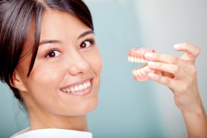 Woman holding teeth sample